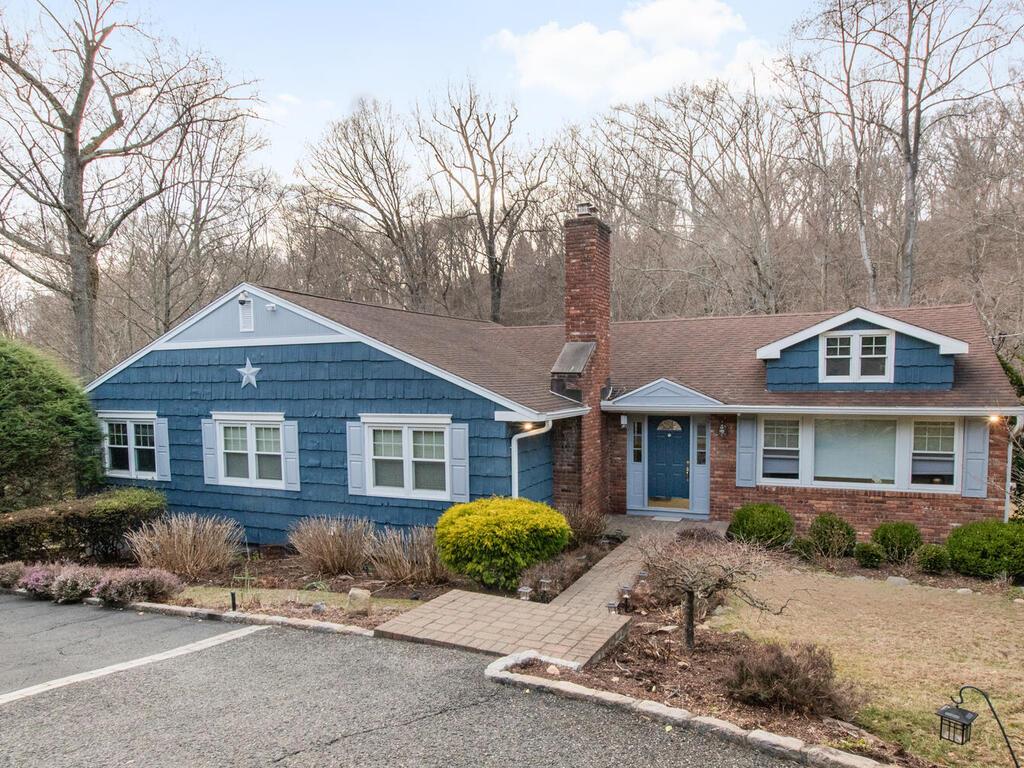 163 Duxbury Road Purchase, NY 10577 - Photo 1 of 37 a view of a yard in front of a house