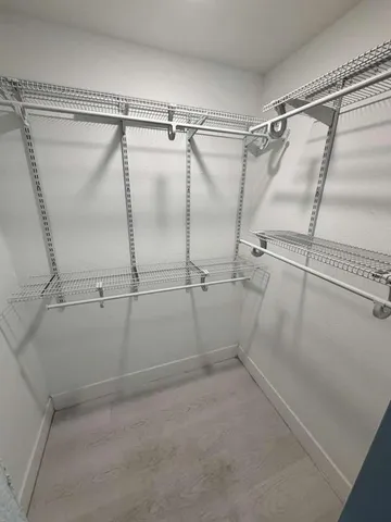 a view of a room with racks on the wall