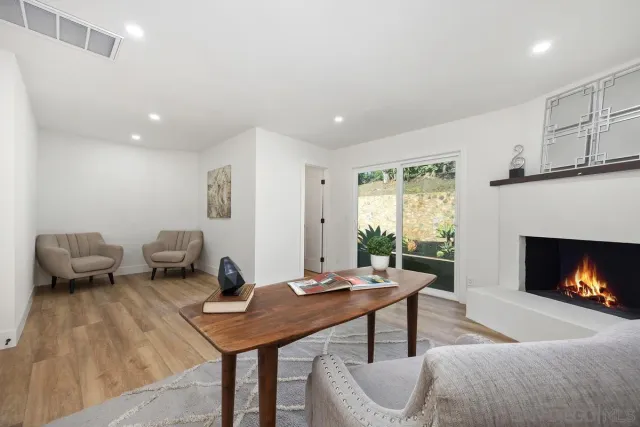 a view of a city with lush green forest