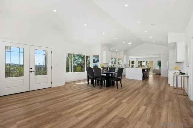 a kitchen with a white wooden cabinets and white appliances