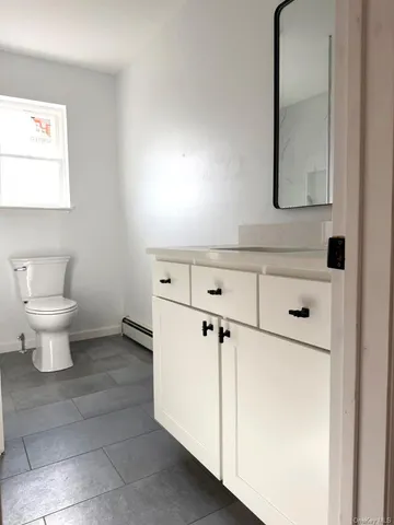a bathroom with a double vanity sink mirror and