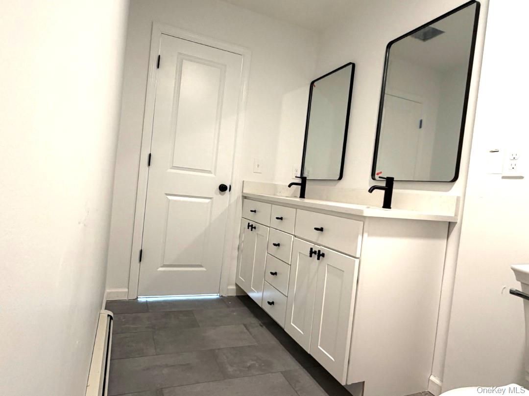 458 County Route 50 New Hampton, NY 10958 - Photo 22 of 35 a bathroom with a double vanity sink mirror and