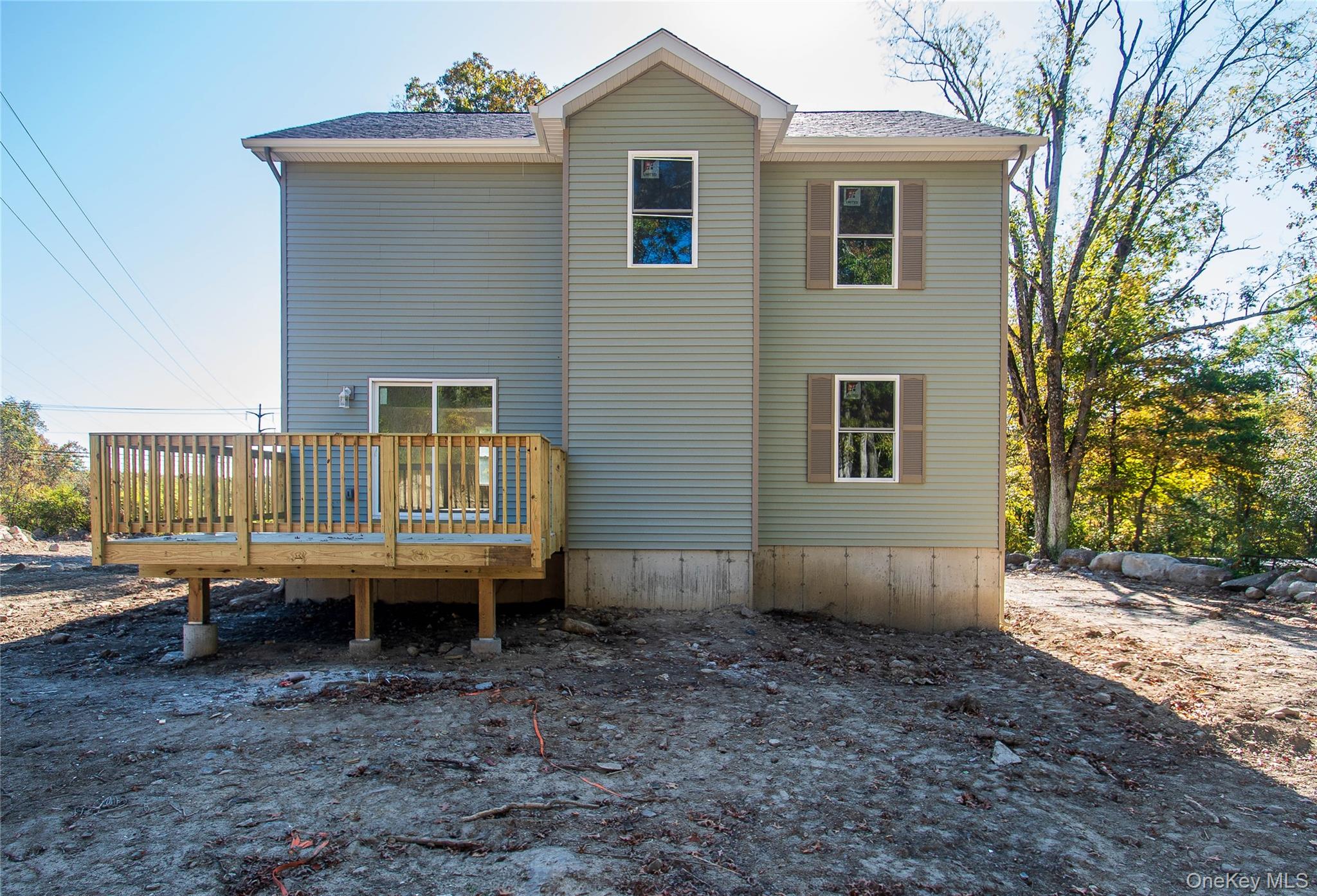 458 County Route 50 New Hampton, NY 10958 - Photo 33 of 35 a view of a house with a yard and wooden fence
