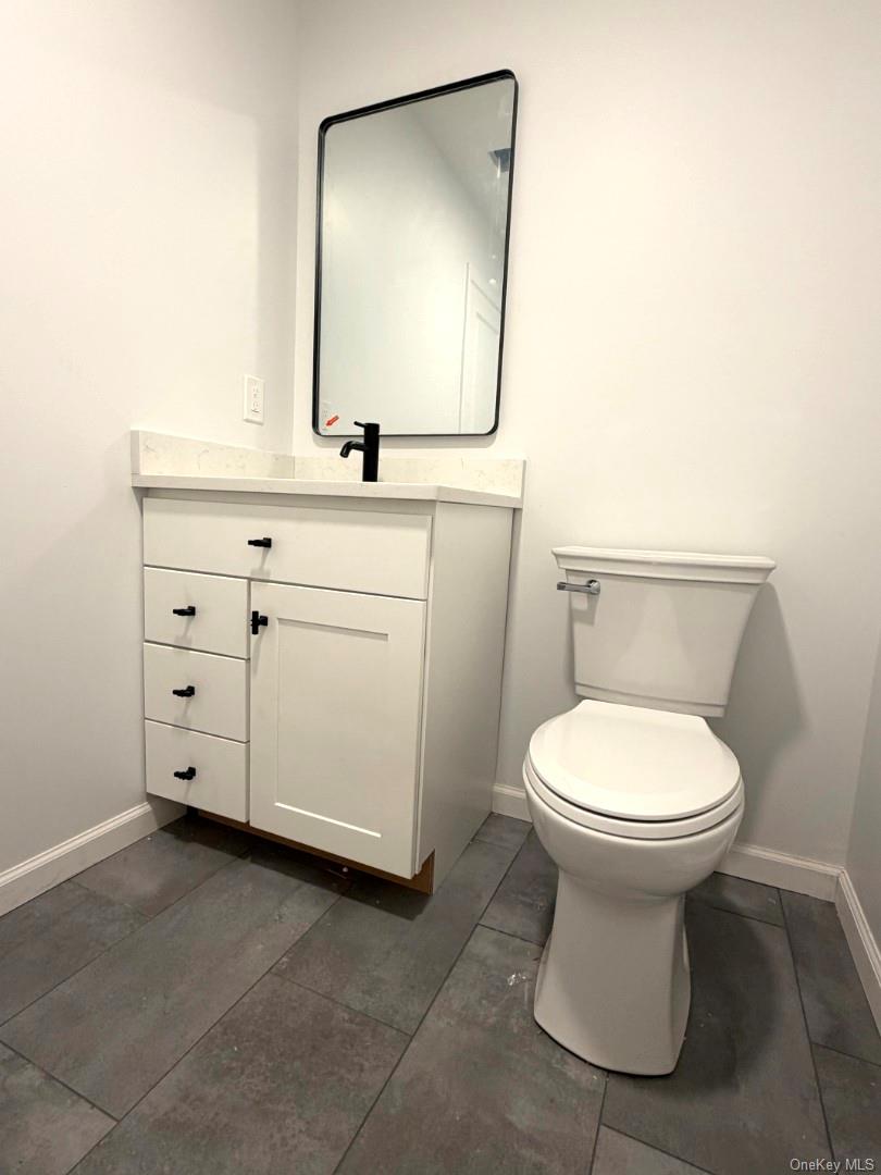 458 County Route 50 New Hampton, NY 10958 - Photo 5 of 35 a bathroom with a toilet sink and mirror
