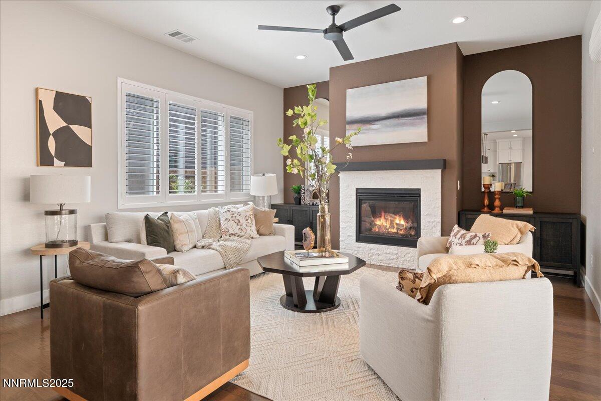 9324 Astaya Drive Reno, NV 89521 - Photo 8 of 63 a living room with furniture and a fireplace