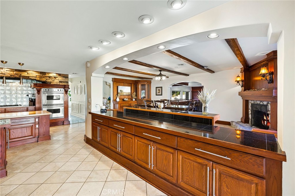 242 Summit Road La Verne, CA 91750 - Photo 23 of 75 a kitchen with stainless steel appliances granite countertop a sink and cabinets