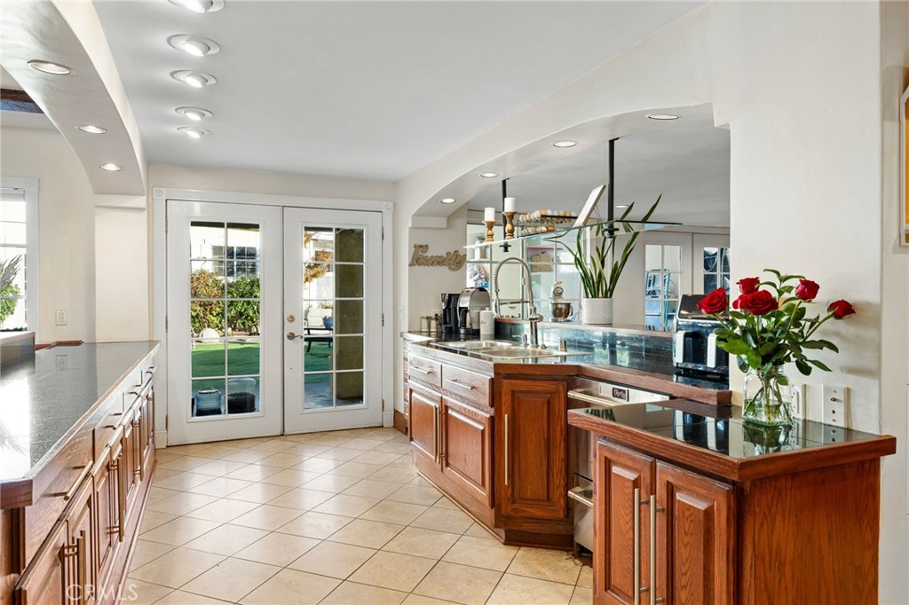 242 Summit Road La Verne, CA 91750 - Photo 26 of 75 a kitchen with stainless steel appliances granite countertop a sink and cabinets
