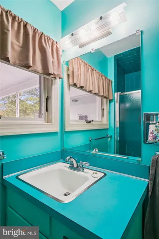 a view of a living room and kitchen