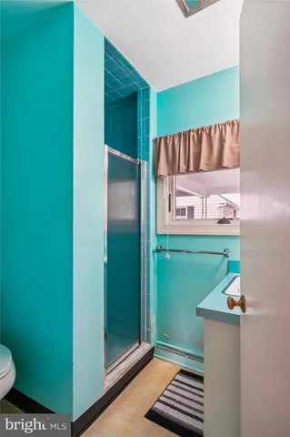 a view of bathroom with sink and mirror