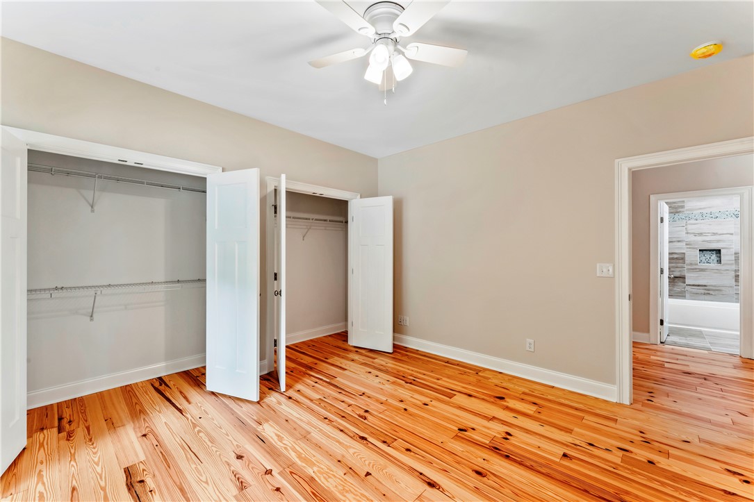 110 Gabriel Way Pickens, SC 29671 - Photo 25 of 48 Natural wood flooring complements this inviting bedroom, featuring ample closet space and convenient bathroom access.