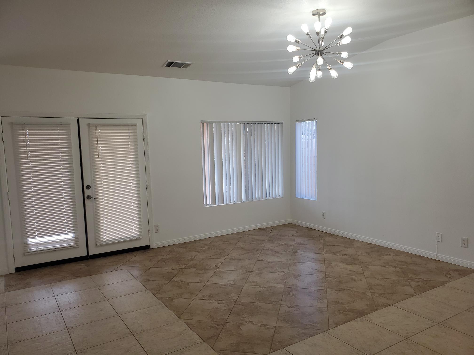 80625 Virginia Avenue Indio, CA 92201 - Photo 4 of 13 a view of an empty room with a chandelier fan