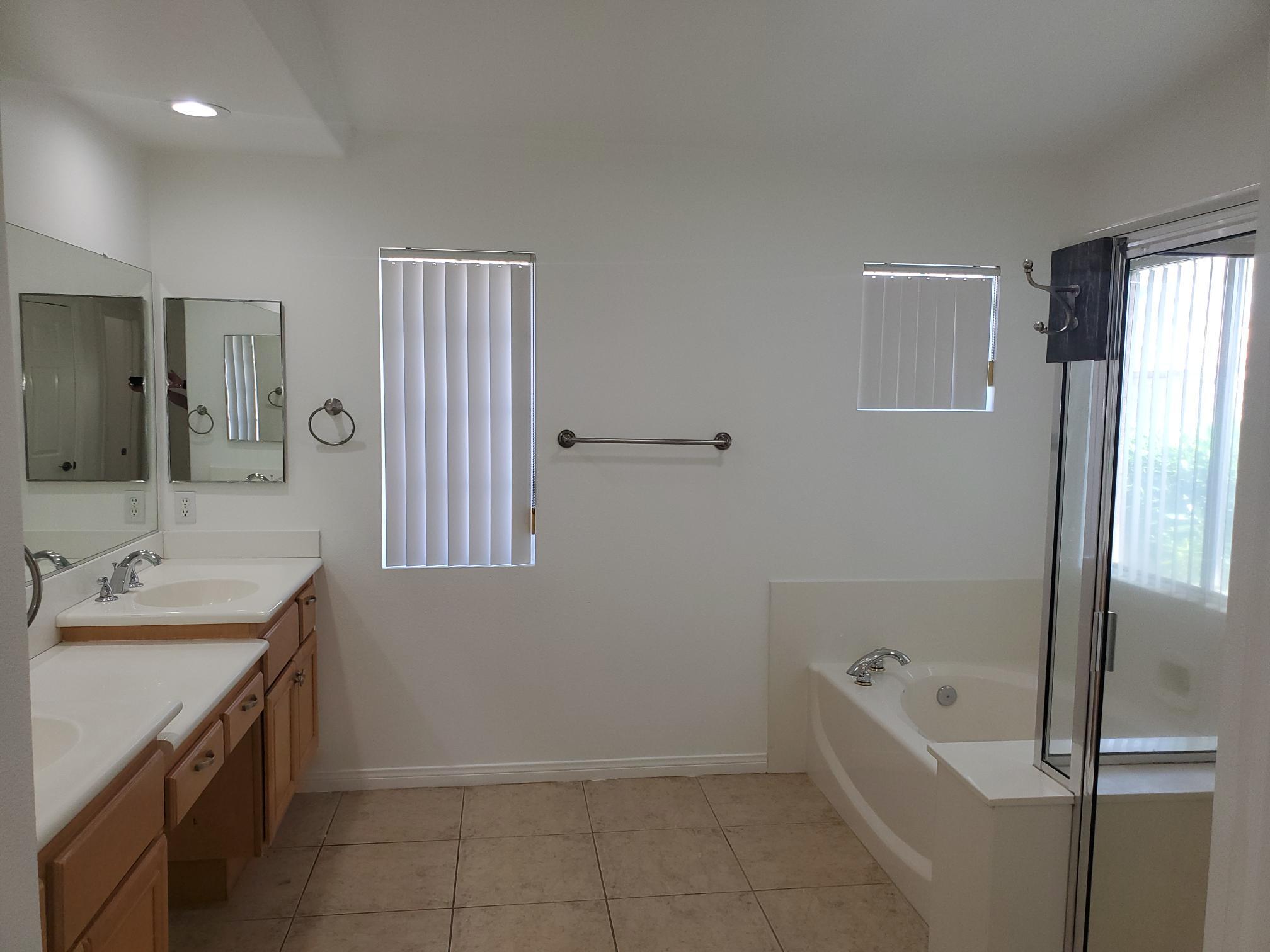 80625 Virginia Avenue Indio, CA 92201 - Photo 8 of 13 a bathroom with a tub sink and mirror