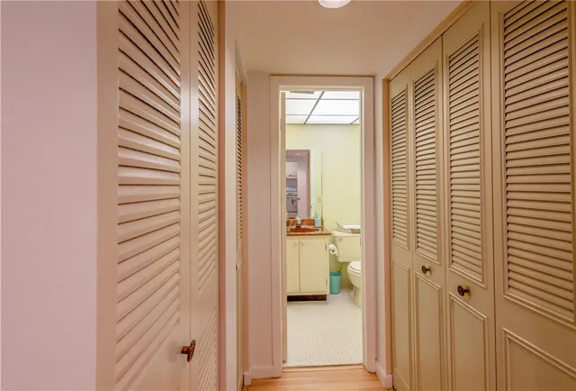 a view of a bathroom from a hallway