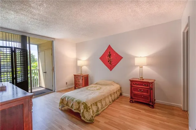 a bedroom with a bed and a book shelf