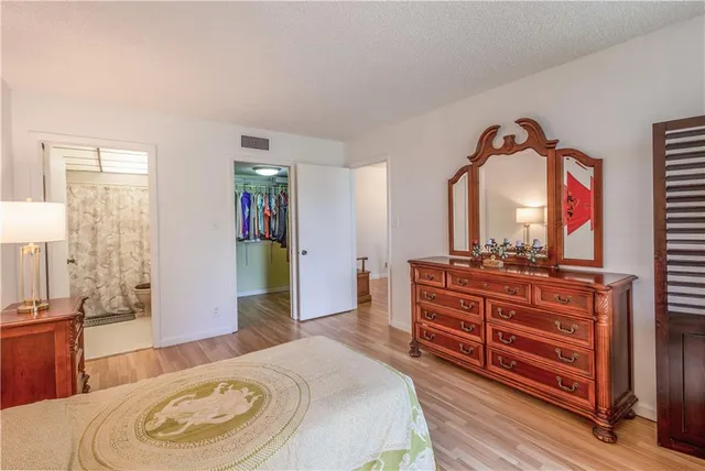 a living room with furniture and a dresser