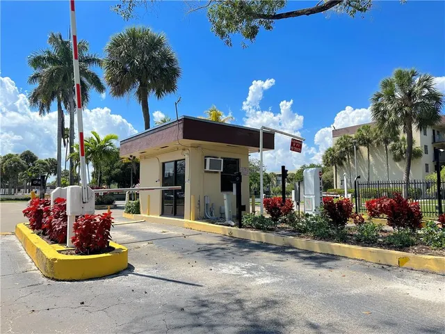 a front view of a house with a fountain and a fountain