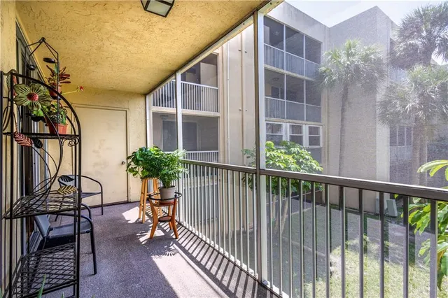 a view of balcony with furniture