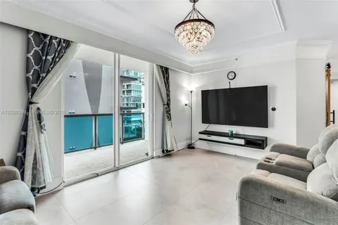 a view of a livingroom with furniture and a chandelier