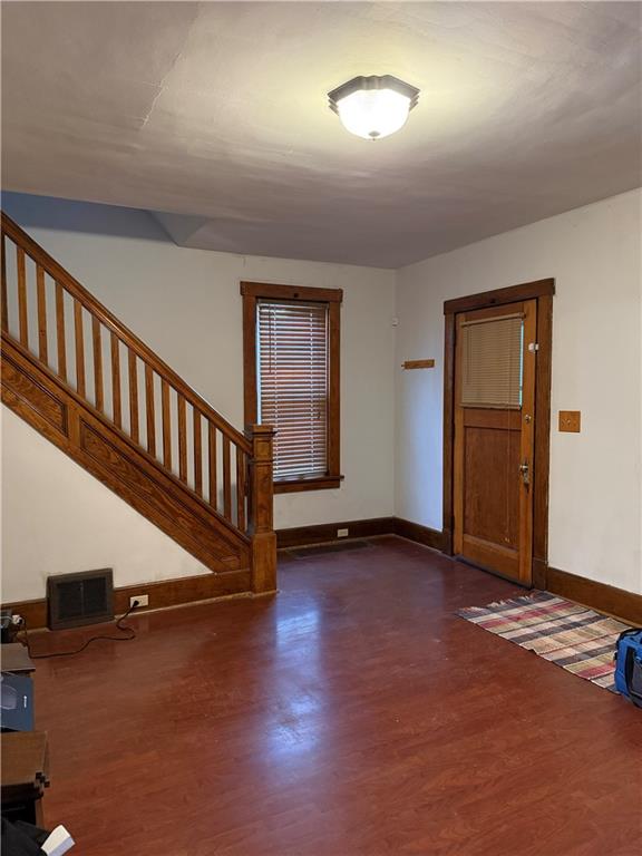 115 Lyon Avenue Butler, PA 16001 - Photo 11 of 32 an empty room with wooden floor and windows