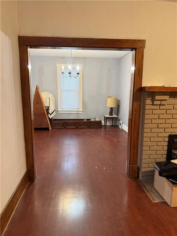 115 Lyon Avenue Butler, PA 16001 - Photo 13 of 32 a view of empty room with wooden floor and chair