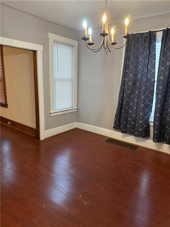 115 Lyon Avenue Butler, PA 16001 - Photo 15 of 32 a view of an empty room with wooden floor and a window