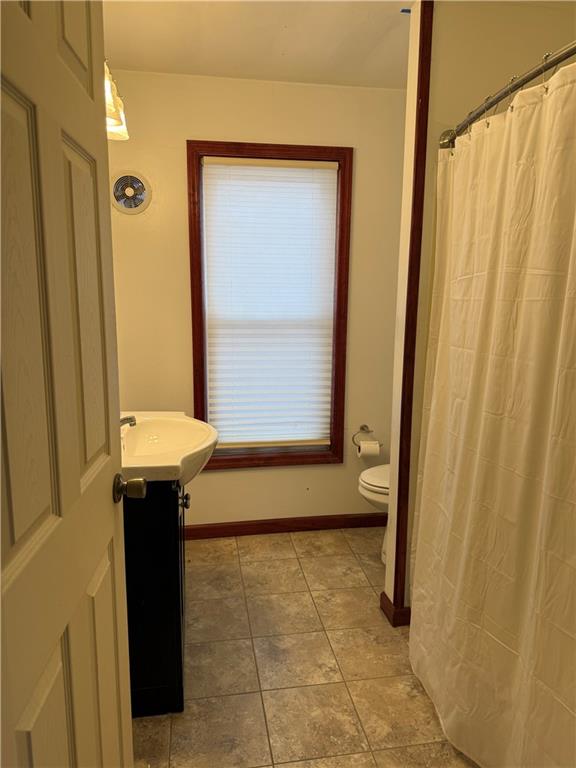 115 Lyon Avenue Butler, PA 16001 - Photo 23 of 32 a bathroom with a sink and a toilet