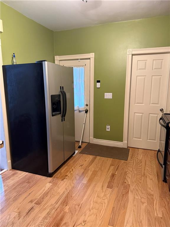 115 Lyon Avenue Butler, PA 16001 - Photo 3 of 32 a view of a refrigerator in kitchen and wooden floor