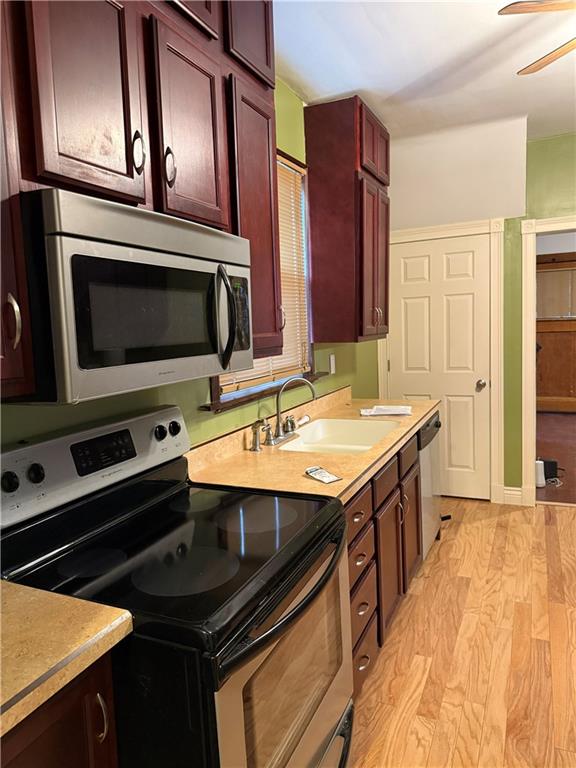 115 Lyon Avenue Butler, PA 16001 - Photo 7 of 32 a kitchen with stainless steel appliances a stove sink and microwave
