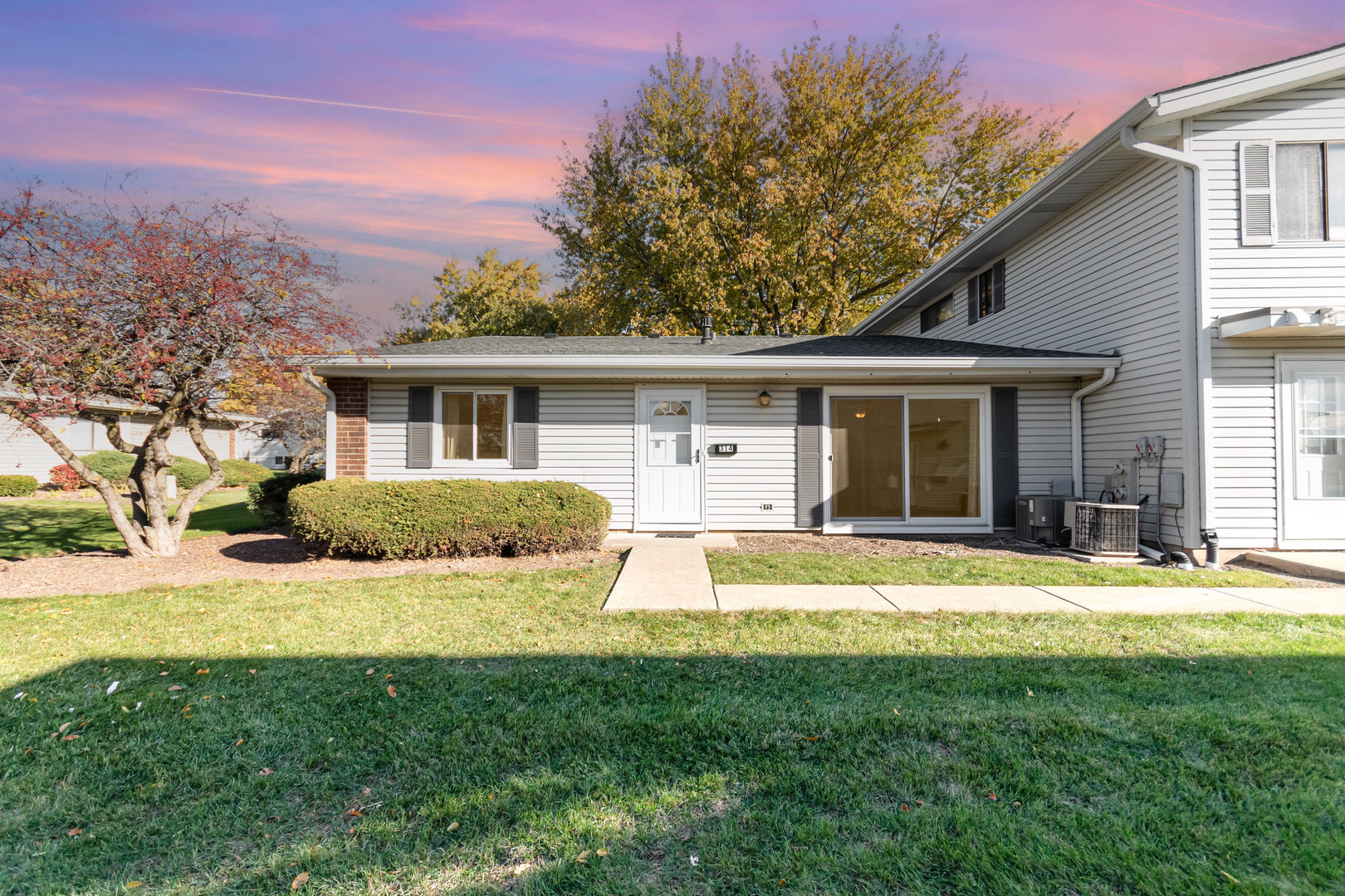 314 Covehill Court, Unit 314 Schaumburg, IL 60193 - Photo 1 of 18 a front view of house with yard and green space