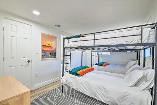 a bedroom with a bed and a table