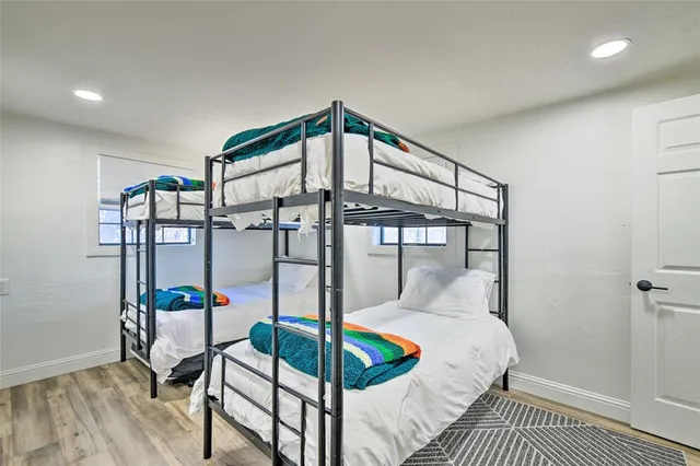 a bedroom with a bed and a mirror