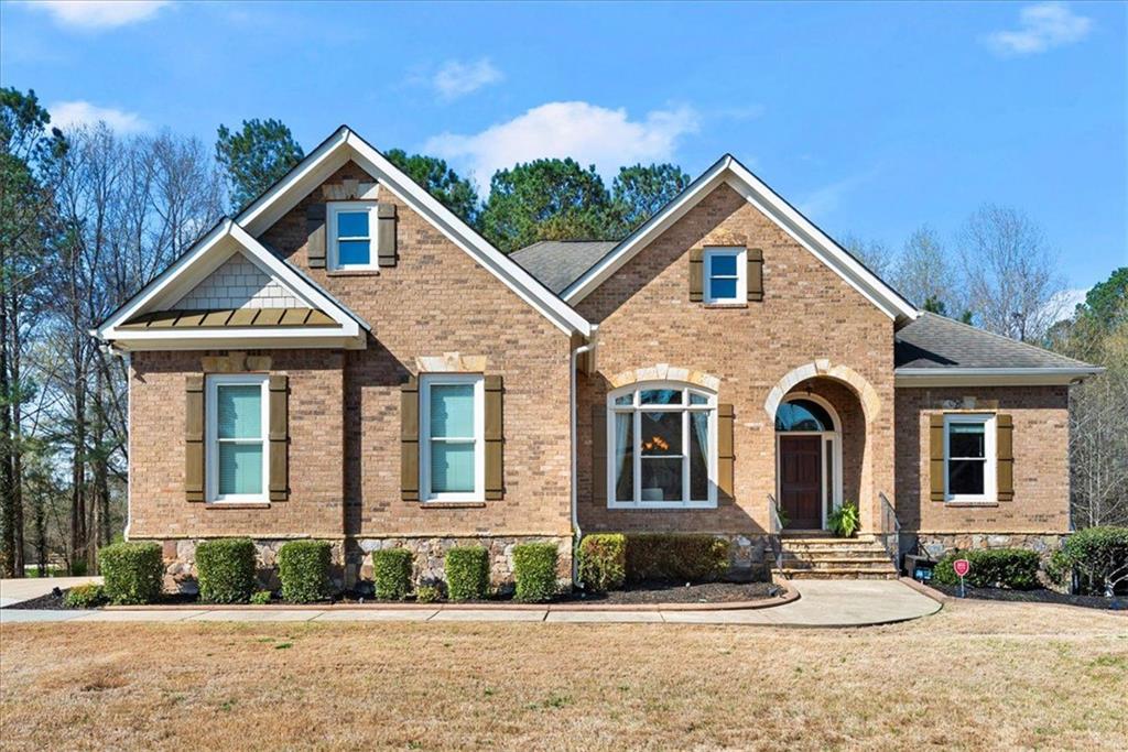 a front view of a house with a yard