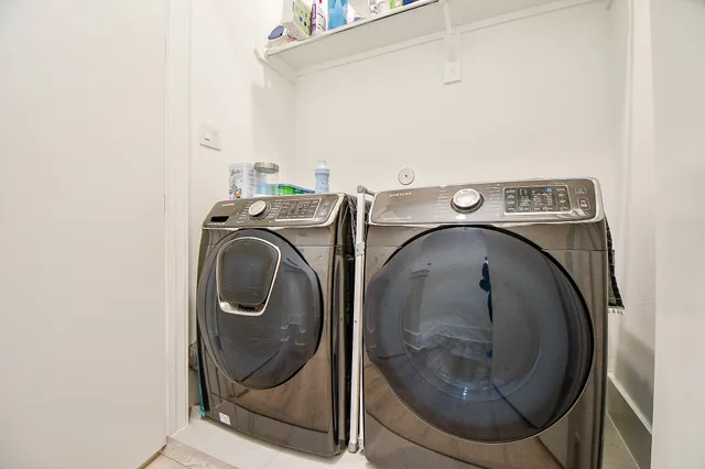 a utility room with dryer and washer