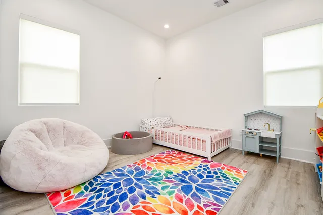 a bedroom with furniture and a window