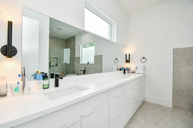 a bathroom with a sink and a mirror