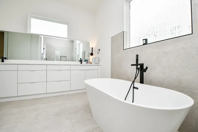 a white bath tub sitting in a bathroom