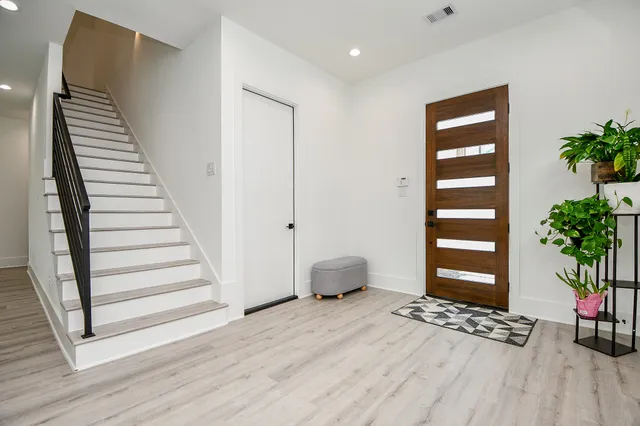 a view of wooden floor and windows in a room