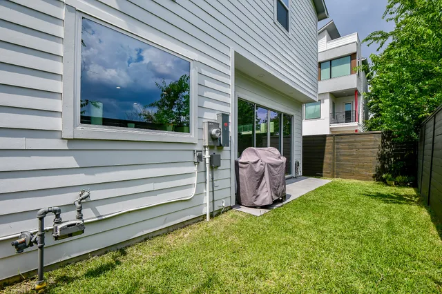 a view of a backyard with garden and plants
