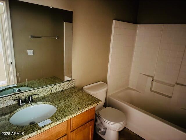 2600 East Springfield Place, Unit 58 Chandler, AZ 85286 - Photo 12 of 14 a bathroom with a granite countertop sink toilet and a mirror
