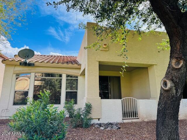 2600 East Springfield Place, Unit 58 Chandler, AZ 85286 - Photo 2 of 14 a front view of a house with garden