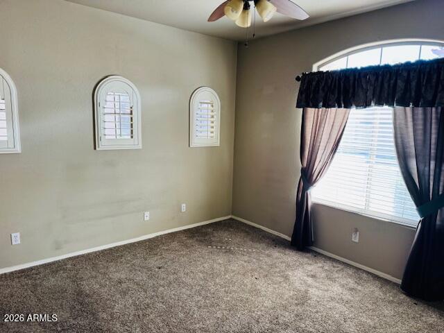 2600 East Springfield Place, Unit 58 Chandler, AZ 85286 - Photo 9 of 14 wooden floor in an empty room with a window