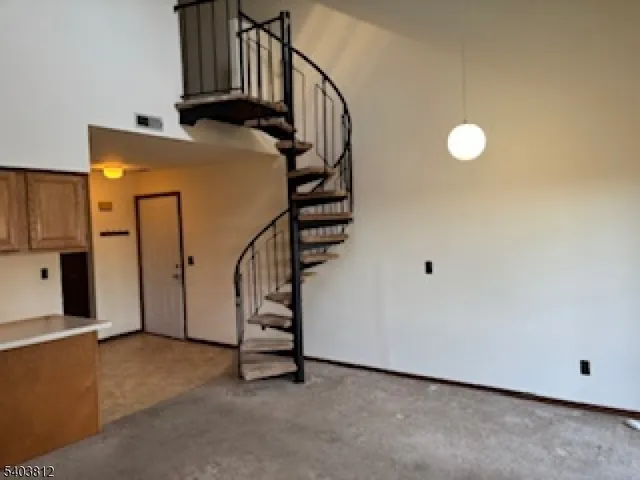 a white toilet sitting next to a shower curtain