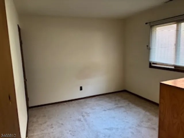 a kitchen with a sink cabinets and window