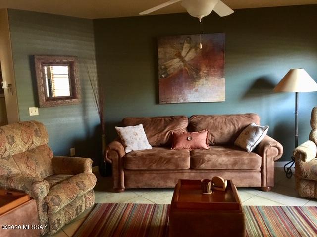 5751 North Kolb Road, Unit 36203 Tucson, AZ 85750 - Photo 4 of 25 a living room with furniture and a lamp