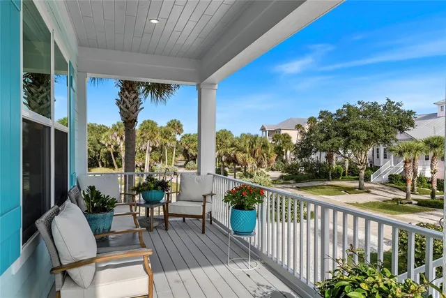 a view of a balcony with furniture