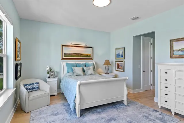 a bedroom with a bed and a dresser