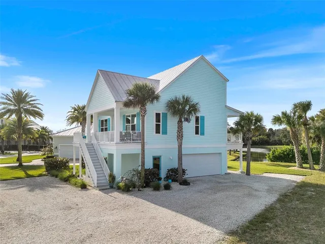 a view of house with outdoor space and swimming pool