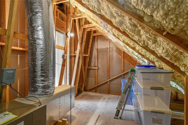a view of a house with a tree