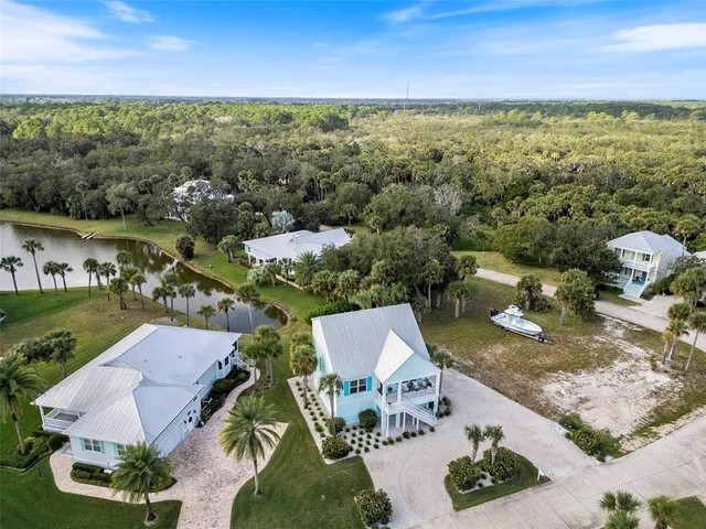 an aerial view of residential houses with outdoor space