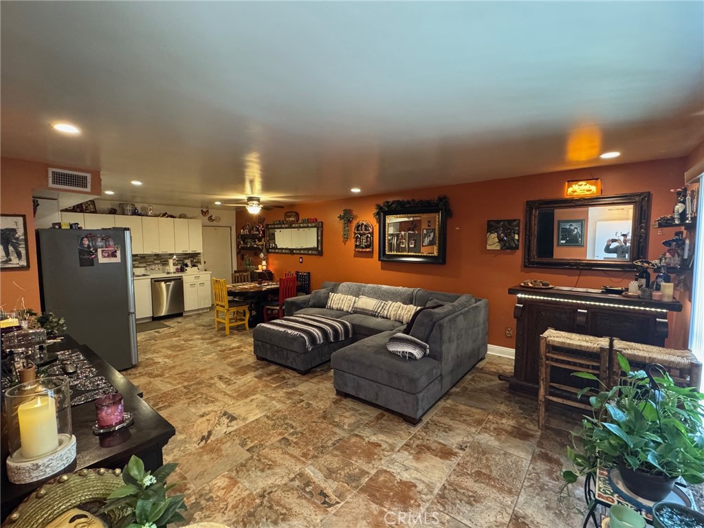 1434 Highland Avenue, Unit 13 Duarte, CA 91010 - Photo 3 of 14 a living room with furniture and a flat screen tv